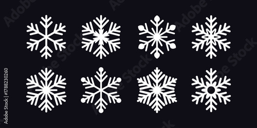 Snowflake icons set. Winter snow symbols isolated on a dark background. vector illustration.