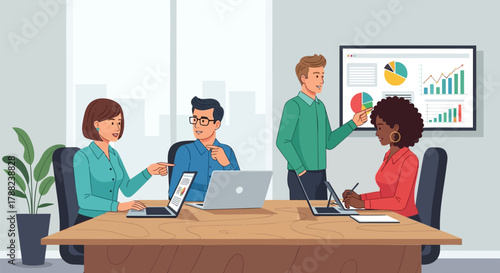 Diverse business professionals collaborating in a modern office meeting discussing charts and graphs on laptops and a presentation screen