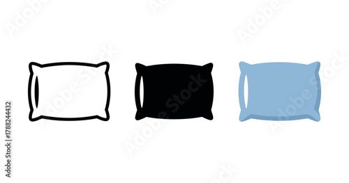 Minimalist trio of black, white, and blue pillows on white background