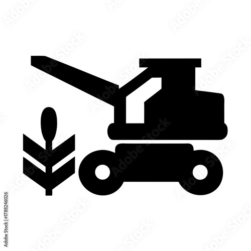 Agricultural combine harvester and wheat stalk silhouette