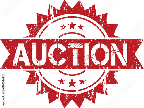 A red auction stamp with a starburst design and the word auction in white lettering across the middle