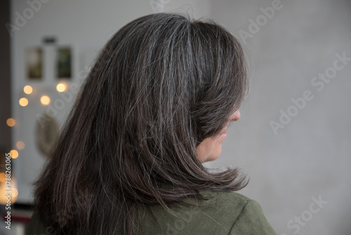 Portrait of a 43-year-old woman with gray hair