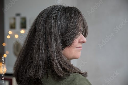 Portrait of a 43-year-old woman with gray hair
