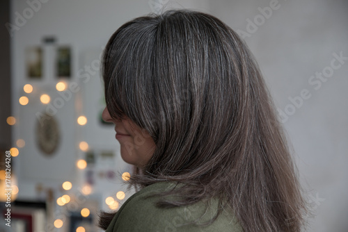 Portrait of a 43-year-old woman with gray hair