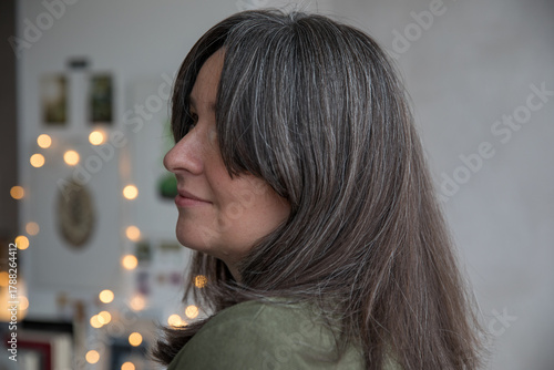 Portrait of a 43-year-old woman with gray hair