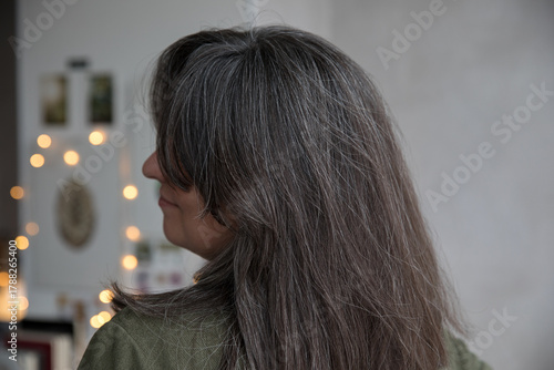 Portrait of a 43-year-old woman with gray hair