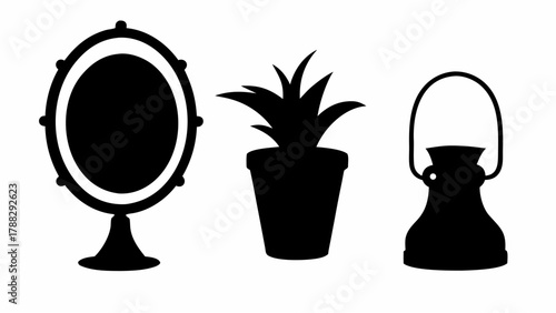 Silhouette of an oval mirror on a stand next to a potted plant and a vintage style hanging lantern