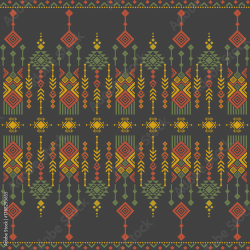 Traditional tribal geometric pattern in red, yellow, and green earth tones on dark background, perfect for textile design, wallpaper, or cultural decor projects.