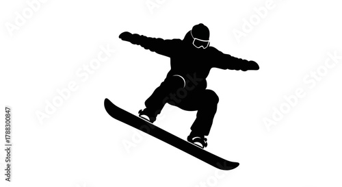 A silhouette of a snowboarder midjump arms outstretched goggles visible
