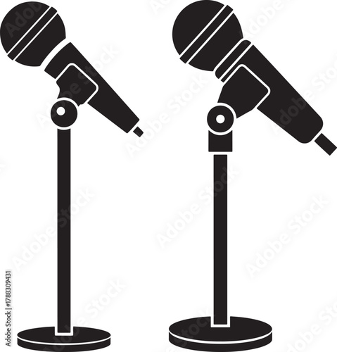 Two microphones on stands silhouette