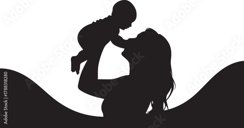 Silhouette of mother lifting her baby into the air with joy