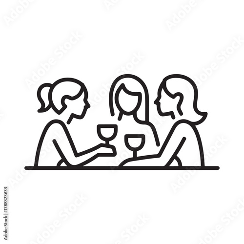 Three women enjoying drinks together at a table