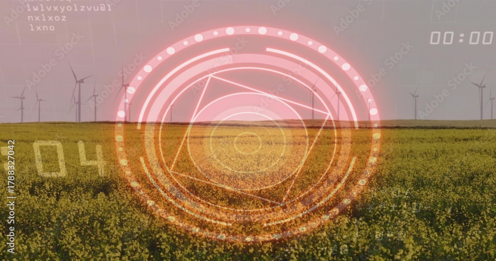 Naklejka premium Projecting circular HUD overlaying farmland, showing canola field and wind turbines on horizon