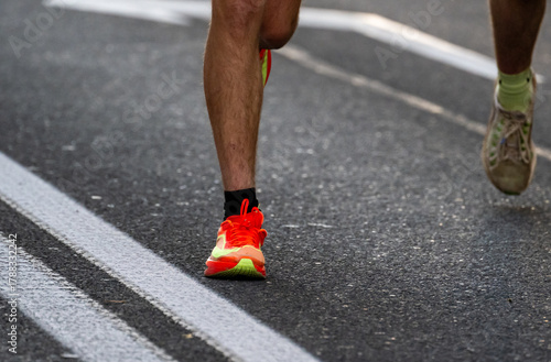Close up of runners feet in bright sneakers competing in Ljubljana marathon race