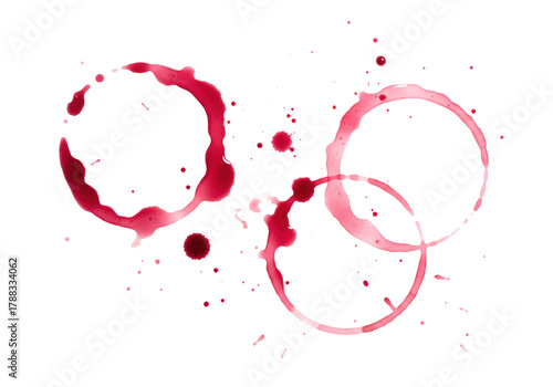 Three distinct red wine glass ring stains, crimson to rosé, with smudges and splatters forming abstract patterns on a transparent background with copy space, soft studio lighting. Concept of