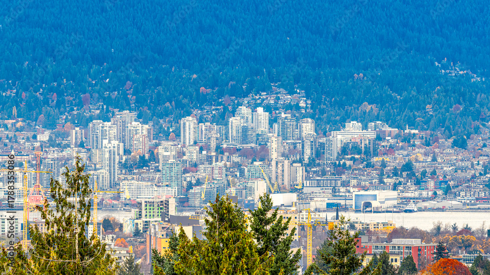 Fototapeta premium Queen Elizabeth Park glows with fiery autumn trees, framing the city and mountains in warm fall colors, Vancouver, BC Canada