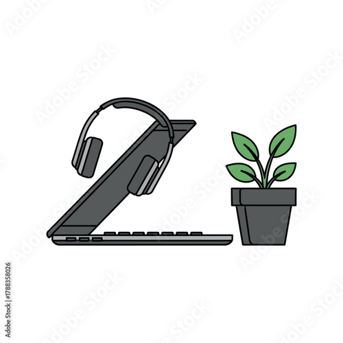 Modern workspace with laptop, headphones, and plant for creative work and focused study creating a productive and inspiring atmosphere for success