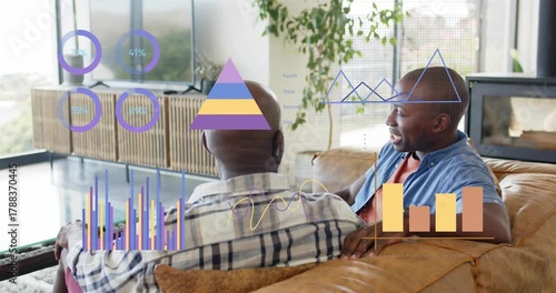 Son turning and speaking, presenting finance rings, pyramid and bars updating while dad listening