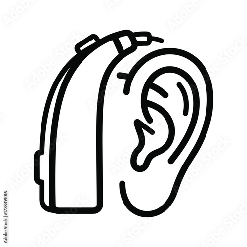 Hearing aid device placed next to a human ear, symbolizing hearing and audiology