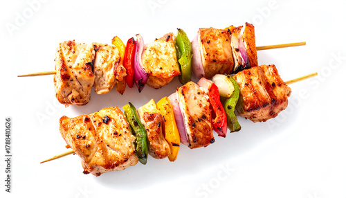 Grilled Chicken Skewers with Vegetables on White Background Close-Up