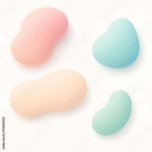 Four soft pastel colored bean shaped objects arranged on a clean white background with subtle shadows