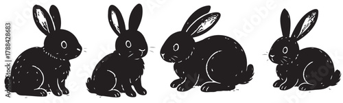 Four black rabbits are sitting in a row. The rabbits are all facing the same direction. The image has a calm and peaceful mood