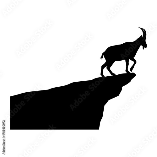 Silhouette of an ibex on the edge of a cliff goat mountain goat