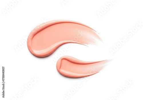 A smear of pink cosmetic cream isolated on a white background