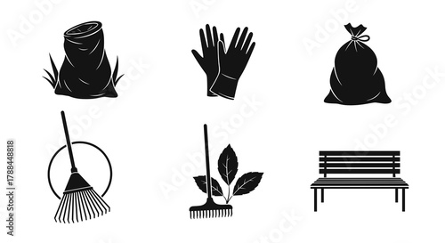 Garden tools and supplies including gloves, rake, and bench  
