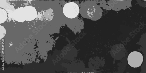 Abstract grayscale background with soft focus circles and textured shapes in a dark moody atmosphere