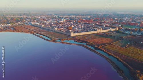 Aerial view of the medieval city of Aigues-Mortes at sunrise, in the Gard department, Occitanie region, France