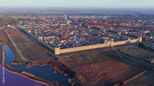 Aerial view of the medieval city of Aigues-Mortes at sunrise, in the Gard department, Occitanie region, France