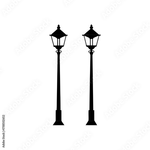 Two black street lamps stand side by side isolated on transparent background