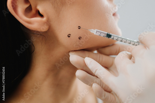 Photos Bruxism injection facial for a treatment with botulinum toxin in an aesthetic medicine clinic