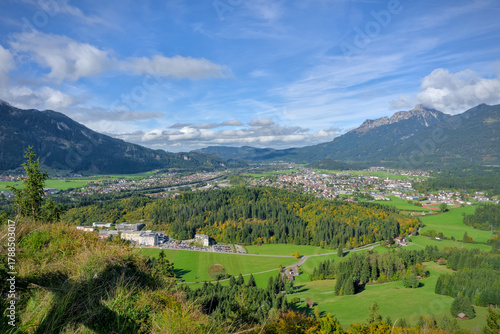 Aerial panoramic view of the Reutte valley and town in the Tyrolean Alps, Austria, on a sunny day.