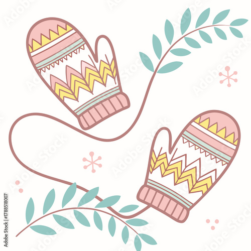 Cozy winter mittens with festive pattern and foliage