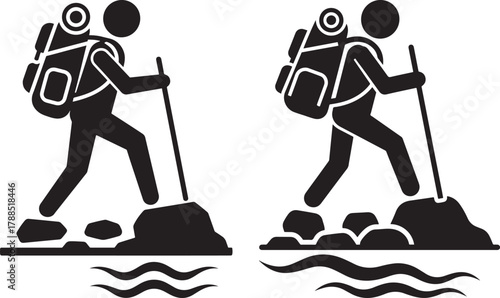 Two hikers with backpacks and poles on rocky terrain silhouette