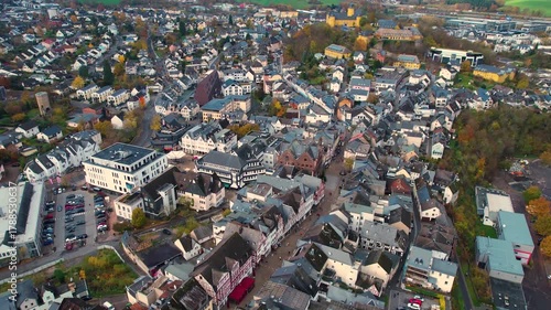 An aerial panorama view above the old town of the city Montabaur on an early summer morning in Germany