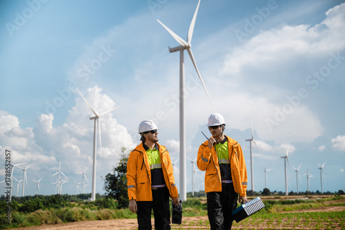 Professional Maintenance Crew Field Inspection Wind Mill Background, Walking Wind Turbine Maintenance Green Power Project. Future Electricity Grid Field Work. Renewable Power Generation Site