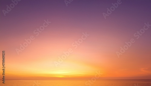 soft blurred gradient sunrise sky displaying pink yellow and orange hues evoking tranquility and warm light