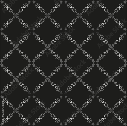 
A beautiful gray seamless pattern on a dark background. Seamless lace texture for fabric or wallpaper.