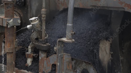 Construction of asphalt roads using an asphalt paver