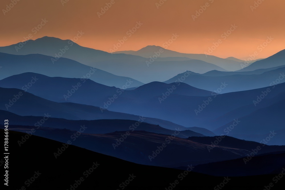 Obraz premium Stunning Abstract Sunset Over Mountain Ridges with Rolling Hills and Cloudy Horizon