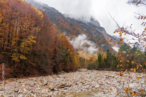 Beautiful and foggy valley in autumn in Ordesa National Park Pyrenees, Huesca Aragon Spain