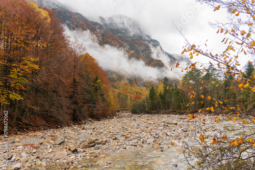 Beautiful and foggy valley in autumn in Ordesa National Park Pyrenees, Huesca Aragon Spain