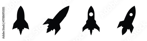 Four black rocket ships vector image for space exploration and science fiction themes design element
