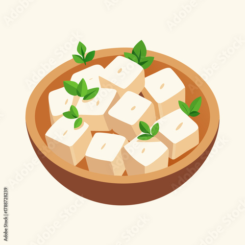 Bowl of tofu cubes garnished with fresh green leaves on a light background