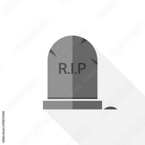 Gray tombstone with R.I.P. inscription and a small piece of grass.