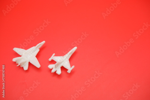 Miniature Jet Fighter Toys Displayed on Red Surface