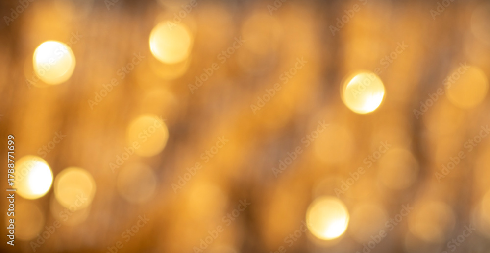 Fototapeta premium Soft Golden Bokeh Lights Create a Warm Abstract Background for Luxury, Festive, and Celebration Uses